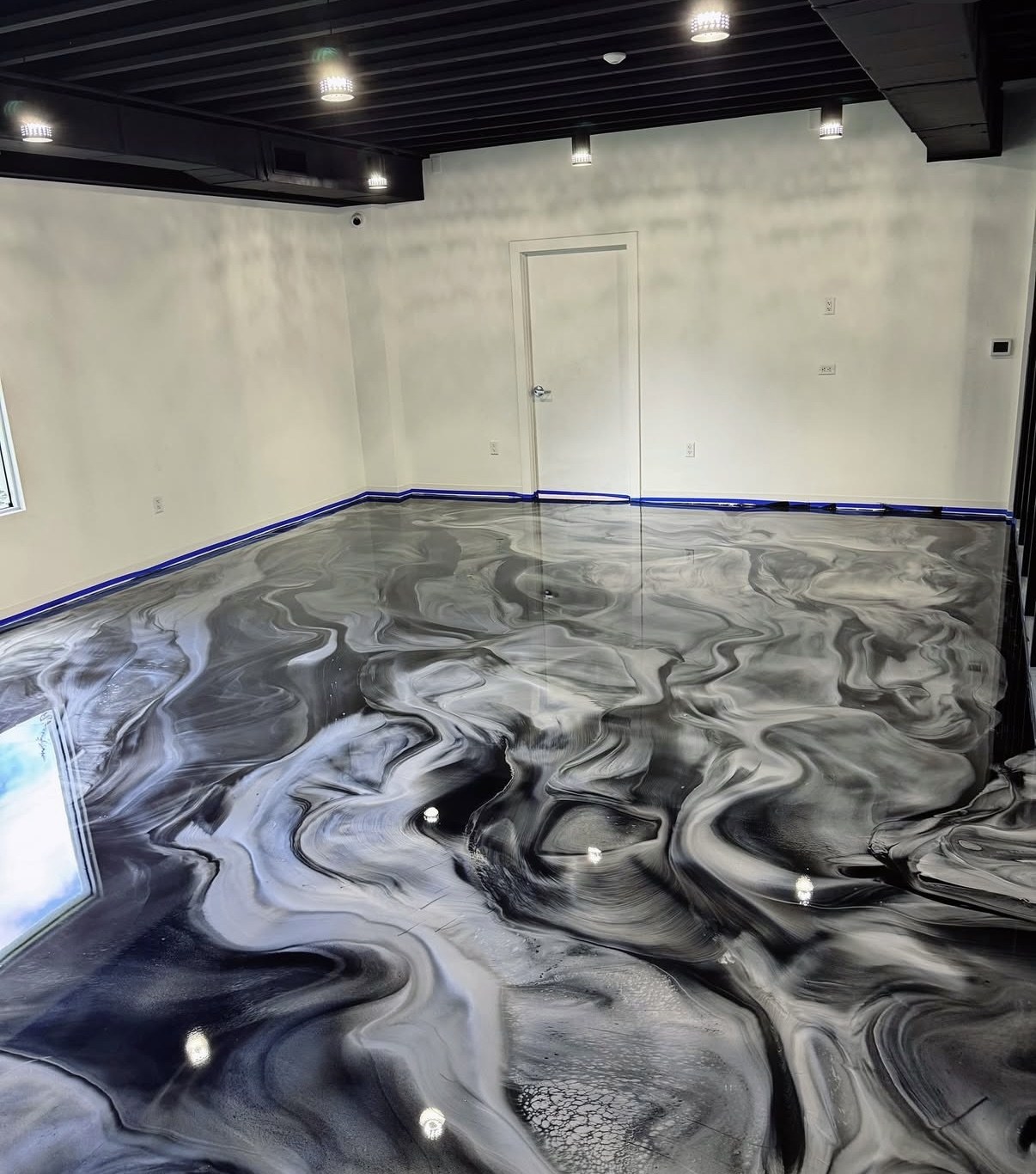 Metallic epoxy garage floor in deep blue