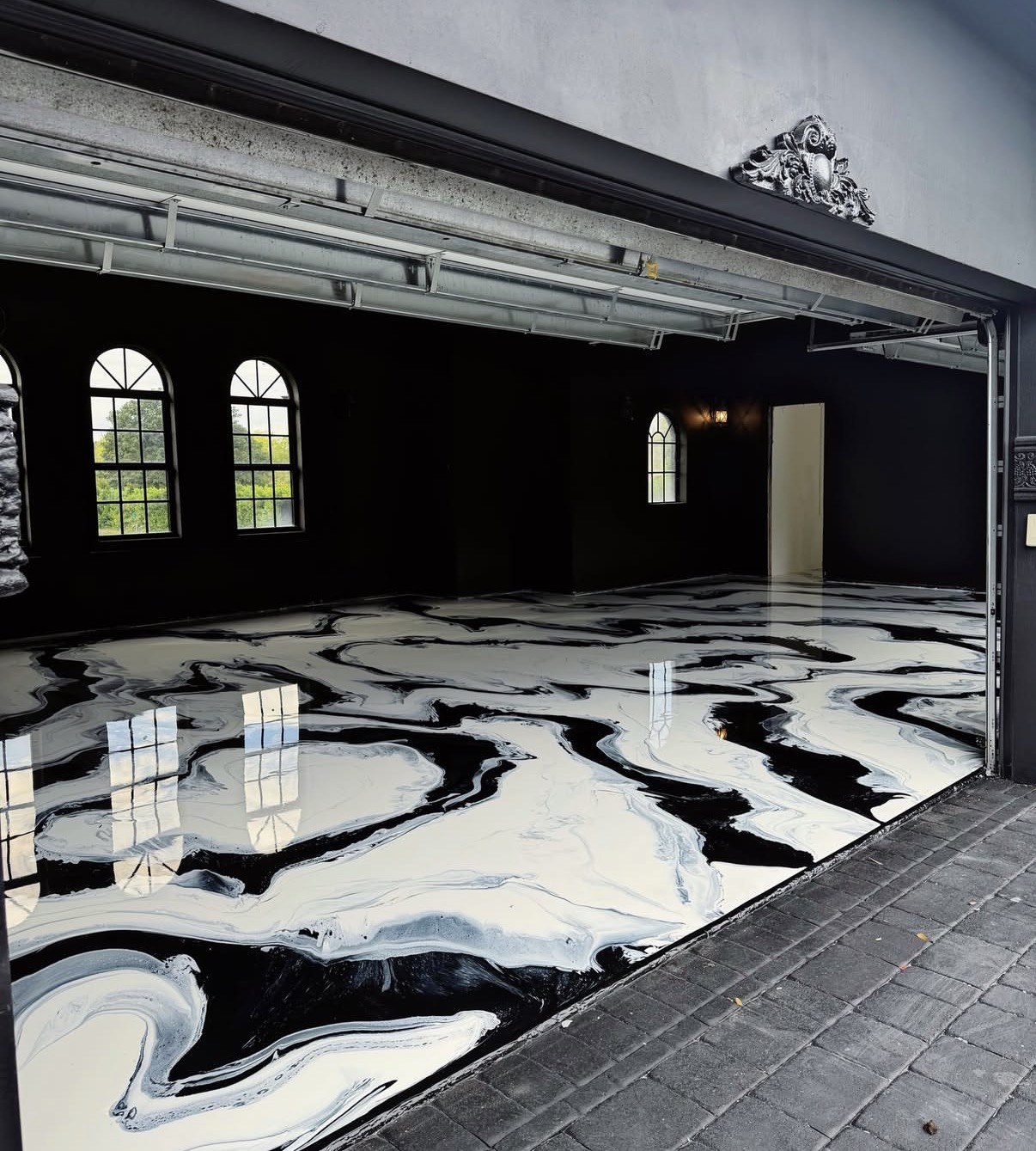 Black and white swirl metallic epoxy garage